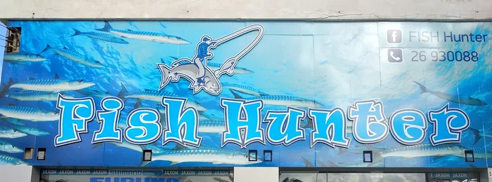 The blue Fish Hunter sign above the shop on Apostolou Pavlou Avenue